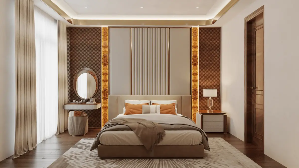 Đầu giường phòng ngủ master – hậu cảnh vách gam nâu hoa tiết kết hợp burl vàng đồng LED nổi bật, gương tròn vàng, bàn trang điểm bọc trắng