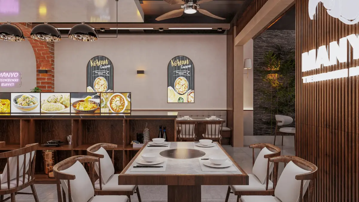Bàn ăn lẩu gỗ – tranh minh họa món Hàn "Korean Cuisine" treo tường, quạt trần gỗ, vòm gạch đỏ, ghế gỗ tựa cong bọc nệm kem