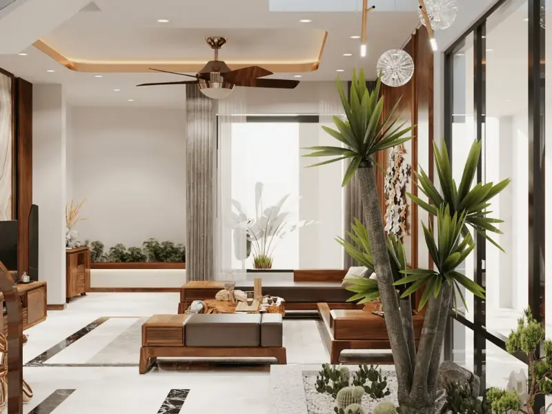 Góc nhìn từ tiểu cảnh – cầu thang trắng lan can kính, bộ sofa gỗ thoáng, sàn marble trắng viền đen, cây xương rồng lớn làm điểm nhấn sống động