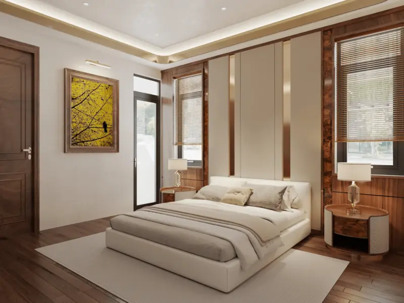 Góc đối diện phòng ngủ phụ 2 – tranh cây vàng mùa thu treo tường, bàn đầu giường tròn chân vàng đồng, cửa đi gỗ óc chó chạm phào