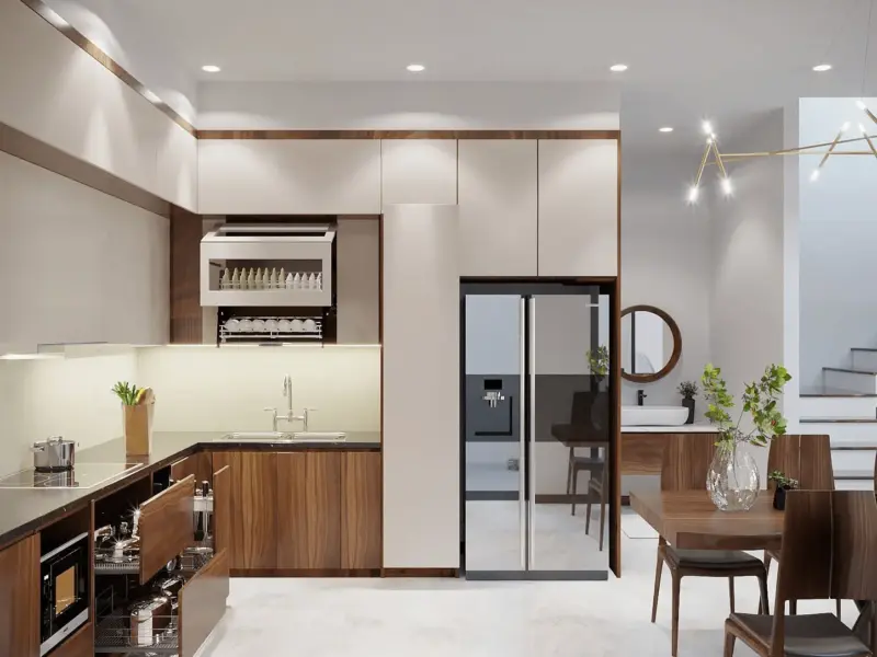 Phòng bếp chữ L – tủ bếp trên trắng, tủ dưới gỗ óc chó, tủ lạnh side-by-side inox, bàn ăn gỗ 6 chỗ đặt cạnh cầu thang