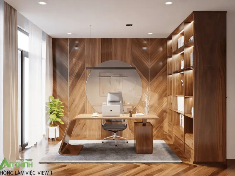 Phòng làm việc nhìn chính diện – vách gỗ xương cá full-height làm nền, bàn làm việc gỗ bo cong nghệ thuật, gương tròn kính treo tường, đèn thả thanh đen