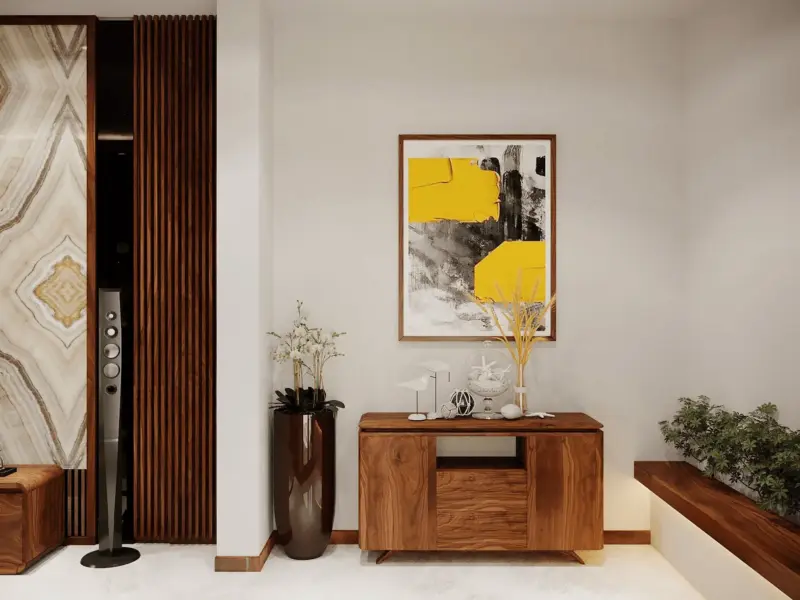 Sảnh tầng 1 – tủ đứng gỗ decor, tranh trừu tượng vàng đen, vách đá onyx vân xuống cá làm phông nền, loa cột hi-end đặt trang trọng