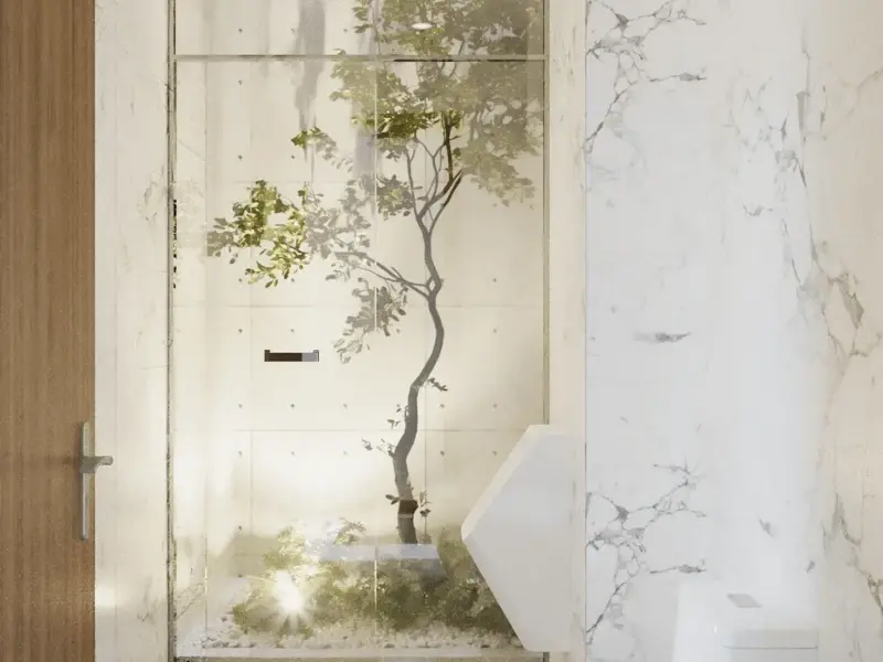 WC tầng 1 đặc biệt – ốp marble trắng sạch, phía sau kính là cây xanh thật trồng trong hốc, tạo cảm giác đi WC như đang ở giữa thiên nhiên